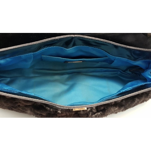 487 - A Fendi Patent Leather and Faux Fur Textile Handbag. Blue textile interior. 30cm length x 22cm heigh... 