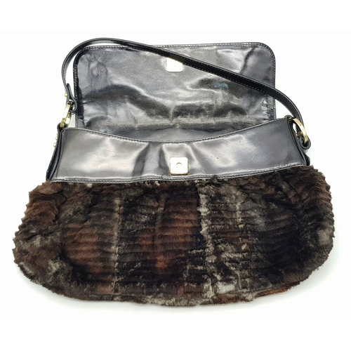 487 - A Fendi Patent Leather and Faux Fur Textile Handbag. Blue textile interior. 30cm length x 22cm heigh... 