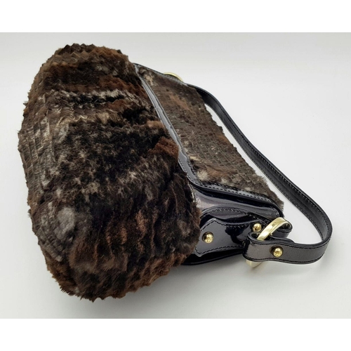 487 - A Fendi Patent Leather and Faux Fur Textile Handbag. Blue textile interior. 30cm length x 22cm heigh... 