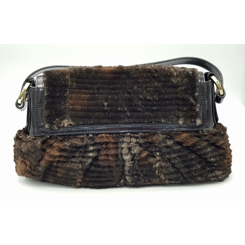 487 - A Fendi Patent Leather and Faux Fur Textile Handbag. Blue textile interior. 30cm length x 22cm heigh... 