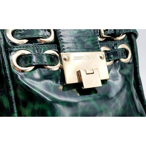 536 - A Jimmy Choo Green Leopard Print Shoulder Bag. Gold tone hardware. Soft textile interior with zipped... 