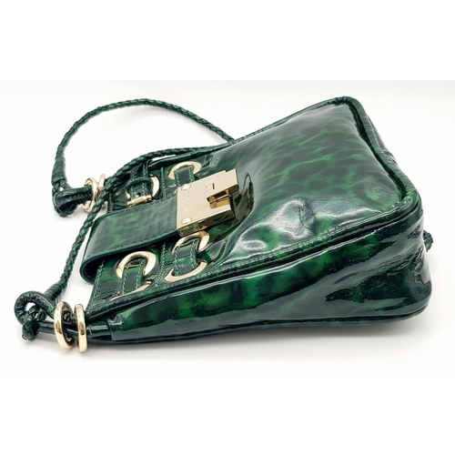 536 - A Jimmy Choo Green Leopard Print Shoulder Bag. Gold tone hardware. Soft textile interior with zipped... 