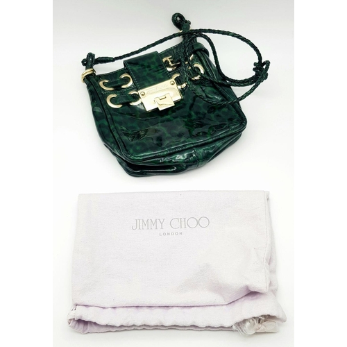 536 - A Jimmy Choo Green Leopard Print Shoulder Bag. Gold tone hardware. Soft textile interior with zipped... 