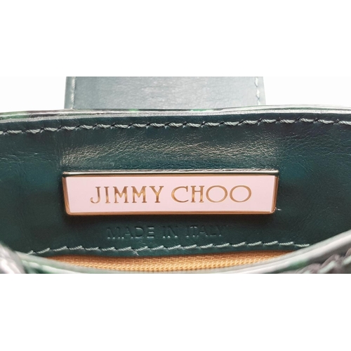 536 - A Jimmy Choo Green Leopard Print Shoulder Bag. Gold tone hardware. Soft textile interior with zipped... 