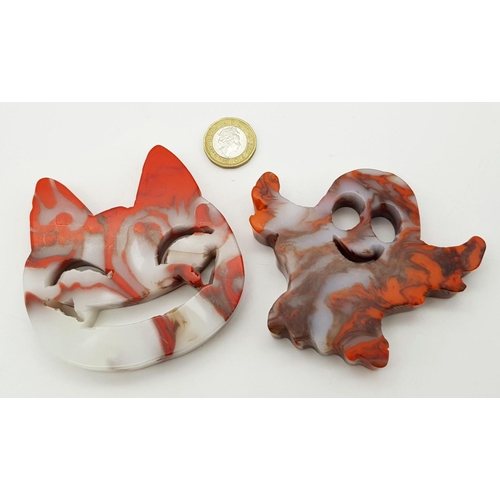 548 - Two Ghoulish Hand-Carved Red and White Coloured Agate Figures. Cheshire cat and ghost!  8 x 8cm.