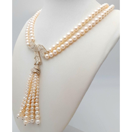 55 - A stunning, vintage, sterling silver necklace with two rows of beautiful, marine, round white pearls... 