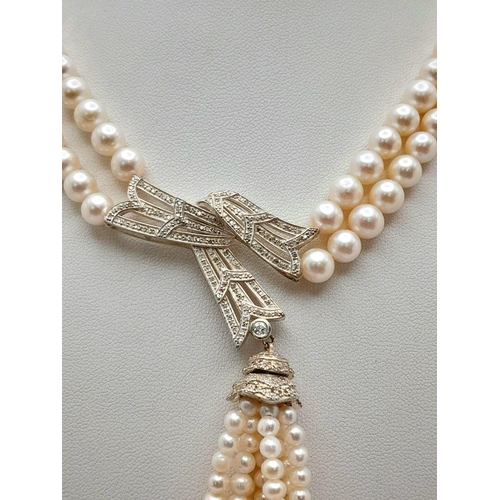 55 - A stunning, vintage, sterling silver necklace with two rows of beautiful, marine, round white pearls... 