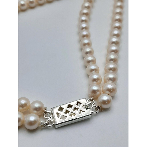 55 - A stunning, vintage, sterling silver necklace with two rows of beautiful, marine, round white pearls... 