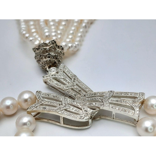 55 - A stunning, vintage, sterling silver necklace with two rows of beautiful, marine, round white pearls... 