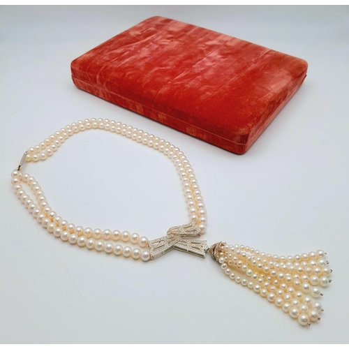 55 - A stunning, vintage, sterling silver necklace with two rows of beautiful, marine, round white pearls... 