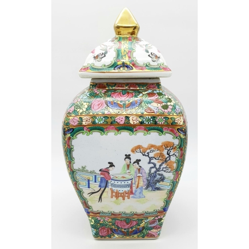 563 - A Large Famille Rose Antique Chinese Vase with Lid. Vibrant colours depicting birds, butterflies, fl... 