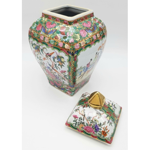 563 - A Large Famille Rose Antique Chinese Vase with Lid. Vibrant colours depicting birds, butterflies, fl... 