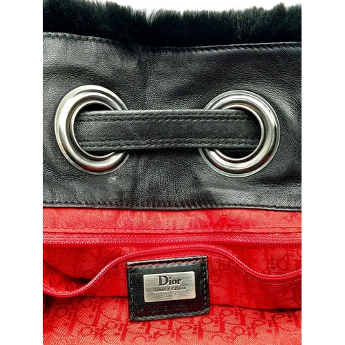 66 - A Christian Dior Faux Fur Shoulder Bag with Hanging Tassels. Silver tone hardware. Red textile inter... 