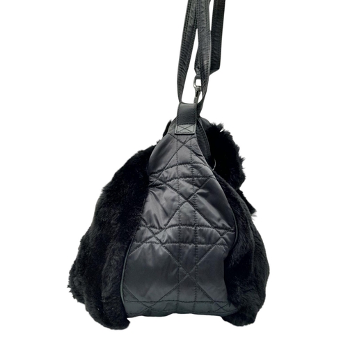 66 - A Christian Dior Faux Fur Shoulder Bag with Hanging Tassels. Silver tone hardware. Red textile inter... 