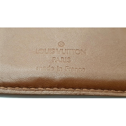 709 - A Louis Vuitton Patent Bronze Leather Purse. Monogram decoration. Brown leather interior. 13cm x 9cm... 