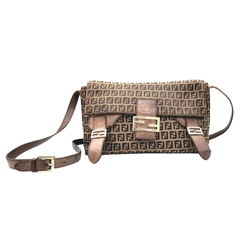 710 - A Fendi Zucca Brown Canvas Tote Bag. Zucca canvas exterior with brown leather trims and silver-toned... 