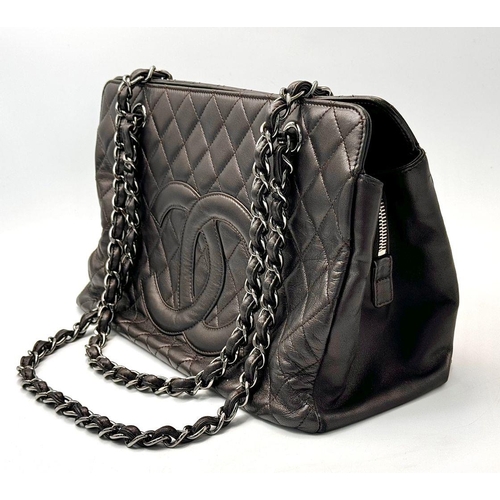 73 - A Chanel Charcoal Grey Shoulder Bag. Quilted leather exterior with Chanel monogram. Silver tone hard... 