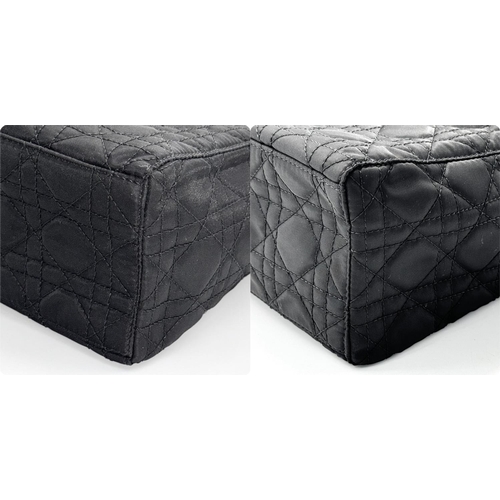 87 - A Christian Dior Black Quilted Tote Bag. Quilted fabric exterior with gold-toned hardware, rolled le... 