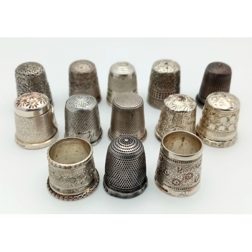 906 - A Collection of 13 Thimbles. 12 sterling silver and 1 white metal.