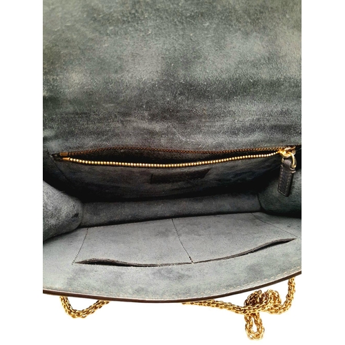 94 - A Valentino Dark Blue Leather Crossbody Bag. Textured exterior with Pyramid stud decoration and gold... 