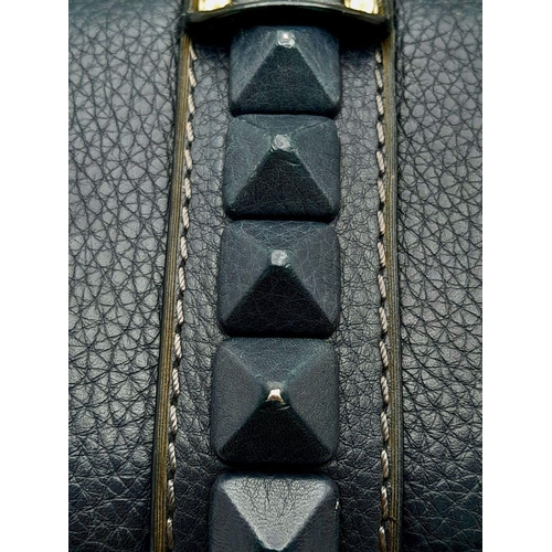 94 - A Valentino Dark Blue Leather Crossbody Bag. Textured exterior with Pyramid stud decoration and gold... 