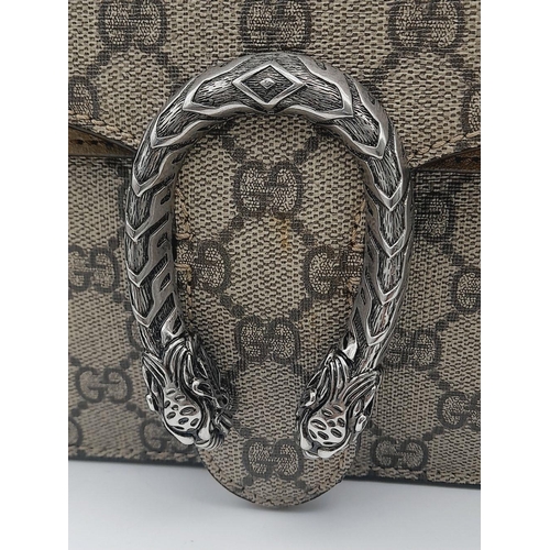 99 - A Gucci Dionysus Shoulder Bag. Monogram textile exterior with silver tone hardware. Open and zipped ... 