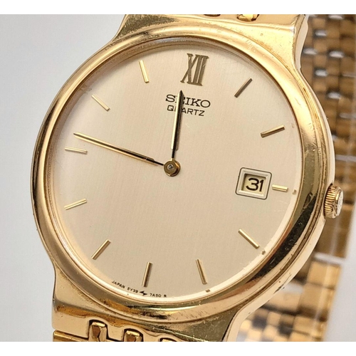 1453 - A Vintage Gold Tone Seiko Model 5Y39-7A40 Quartz Date Watch-34mm Case. Inscription on case back. New... 