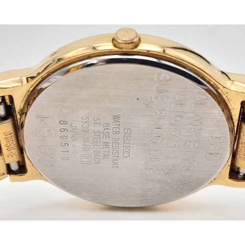 1453 - A Vintage Gold Tone Seiko Model 5Y39-7A40 Quartz Date Watch-34mm Case. Inscription on case back. New... 