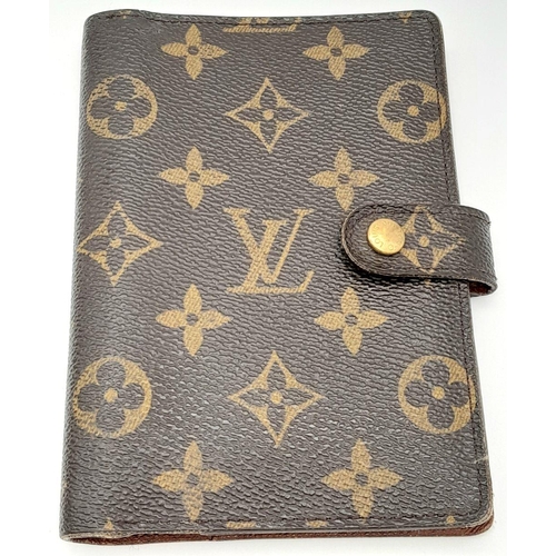 1383 - A Louis Vuitton Agenda/Planner Cover. Monogram coated canvas exterior with gold-toned hardware and p... 