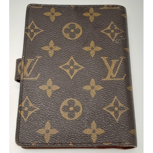 1383 - A Louis Vuitton Agenda/Planner Cover. Monogram coated canvas exterior with gold-toned hardware and p... 