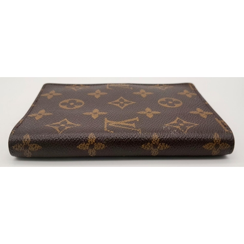 1383 - A Louis Vuitton Agenda/Planner Cover. Monogram coated canvas exterior with gold-toned hardware and p... 