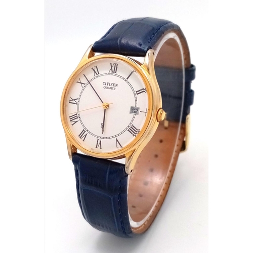 1390 - A Citizen Quartz Gents Watch. Blue leather strap. Gilded case - 32mm. White dial with date window. I... 