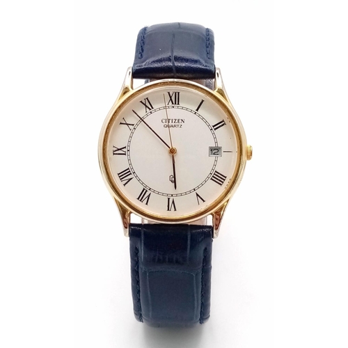 1390 - A Citizen Quartz Gents Watch. Blue leather strap. Gilded case - 32mm. White dial with date window. I... 