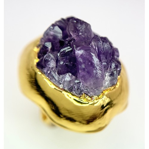 1373 - A very unusual, lavishly gold-plated bangle and matching ring with large, natural, Amethyst crystal ... 