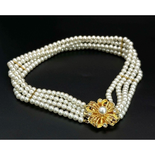 1380 - A very feminine and stylish PIERRE CARDIN three strand faux pearl chocker necklace with a very ornat... 