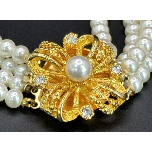 1380 - A very feminine and stylish PIERRE CARDIN three strand faux pearl chocker necklace with a very ornat... 