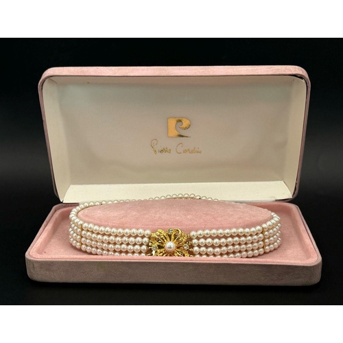 1380 - A very feminine and stylish PIERRE CARDIN three strand faux pearl chocker necklace with a very ornat... 