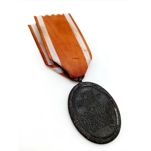 664 - A WW2 German West Wall Medal. Awarded to those who had built or served on the Siegfried Line.