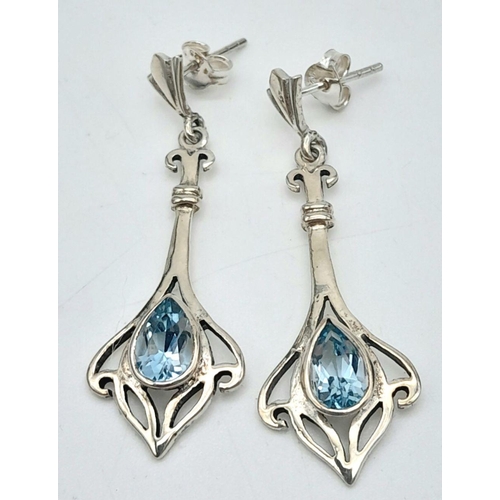 1462 - A Superb Celtic Design, Sterling Silver, Blue Topaz Necklace and Matching Earrings Set by the Renown... 