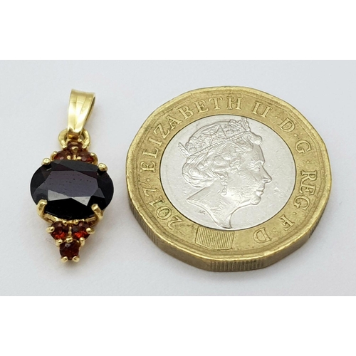 1455 - A Vintage 18 Carat Yellow Gold Bohemian Garnet Pendant. 2.3 cm Length. Set with a 1cm Long Oval Cut ... 