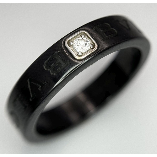 778 - A Designer Bulgari, Black Ceramic and Diamond Ring. Size S.
018940.