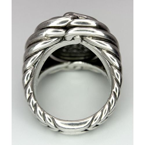 771 - A Designer David Yurman 925 Silver and Diamond Ring. Futuristic twisted metal meets a window of pave... 