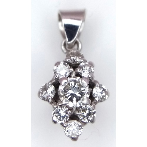 925 - An 18K White Gold Diamond Pendant in Floral Form. 16mm. 1.85g total weight. Ref: 019062