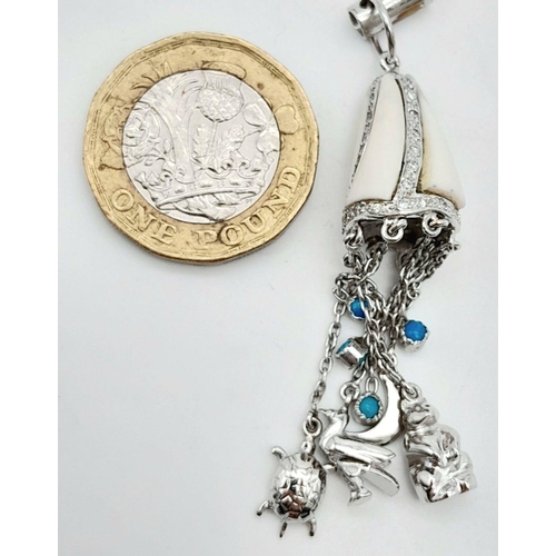 981 - A Vintage 18K White Gold, Diamond, and White Enamel Hanging Charm Pendant. Includes duck, bear, turt... 