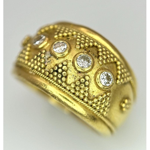 638 - A 22K Yellow Gold Four Stone Diamond Ring. Etruscan style wide band ring with beaded geometric decor... 