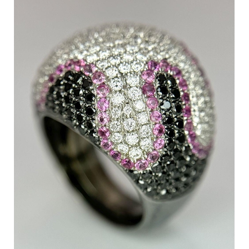 554 - An Elaborate 18K White Gold Multi-Coloured Diamond Dress Ring. Abstract pave design, with white, bla... 