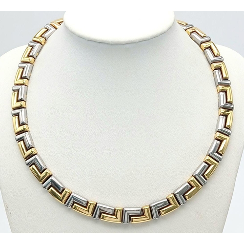 561 - A Gorgeous Bvlgari Collar Necklace in 18K Gold and Steel. Geometric design. Hinged clip mechanism. I... 