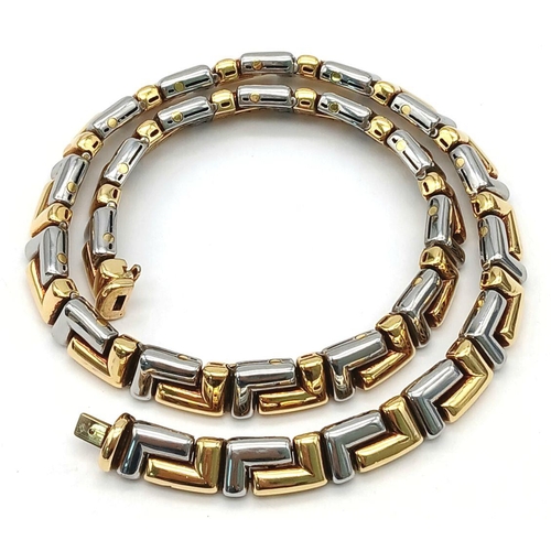 561 - A Gorgeous Bvlgari Collar Necklace in 18K Gold and Steel. Geometric design. Hinged clip mechanism. I... 