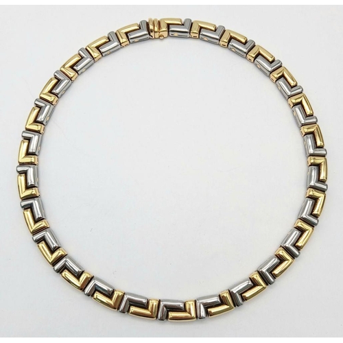 561 - A Gorgeous Bvlgari Collar Necklace in 18K Gold and Steel. Geometric design. Hinged clip mechanism. I... 