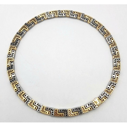 561 - A Gorgeous Bvlgari Collar Necklace in 18K Gold and Steel. Geometric design. Hinged clip mechanism. I... 